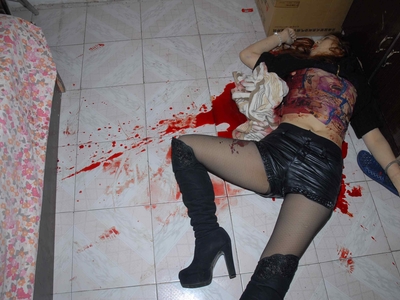 Prostitute found dead in room (examined)