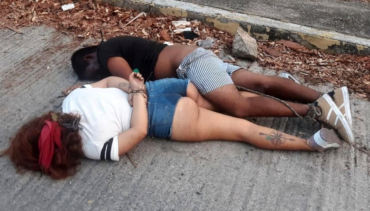 Young Couple Found Garroted in the Street