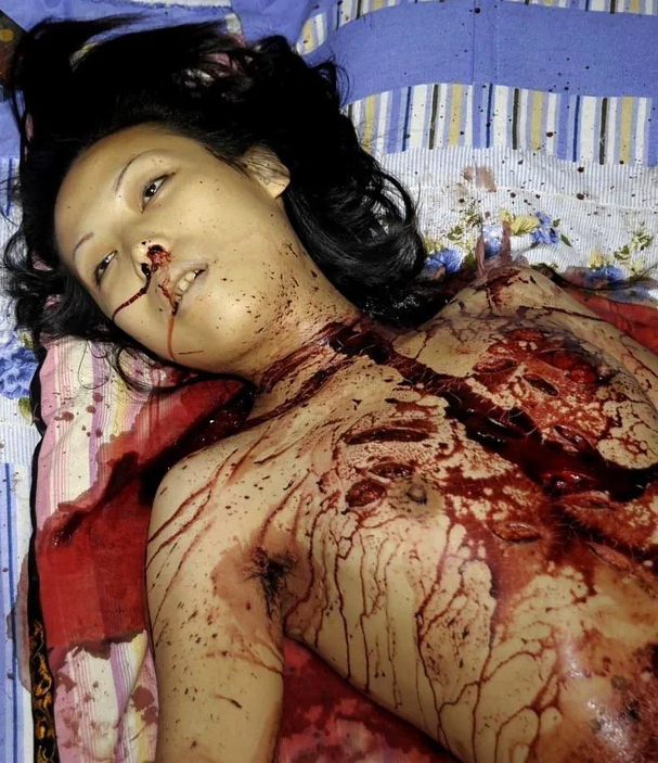 Woman stabbed to death with a partial autopsy at the scene