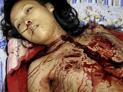 Woman stabbed to death with a partial autopsy at the scene