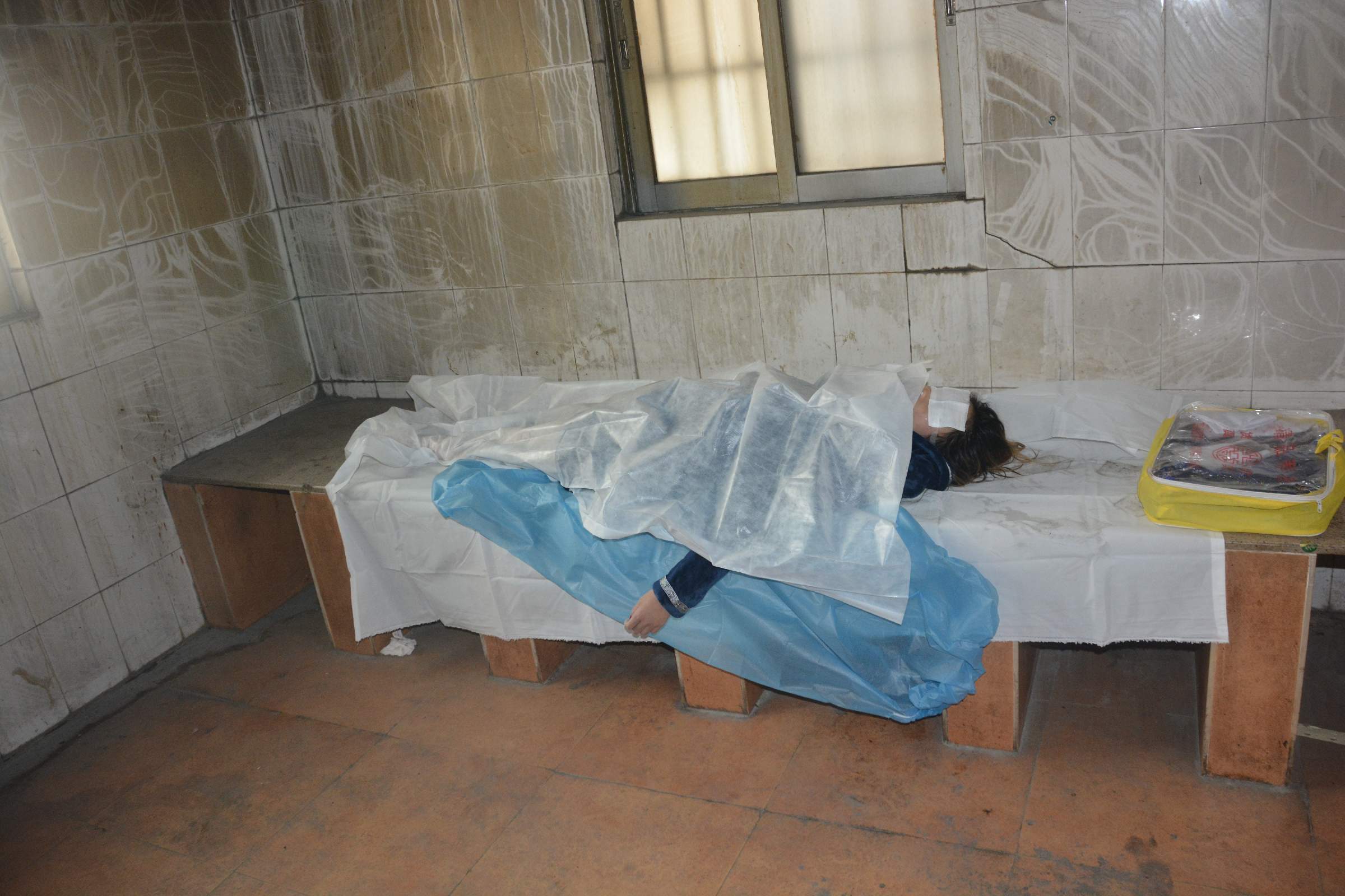 Pretty Chinese girl naked in morgue