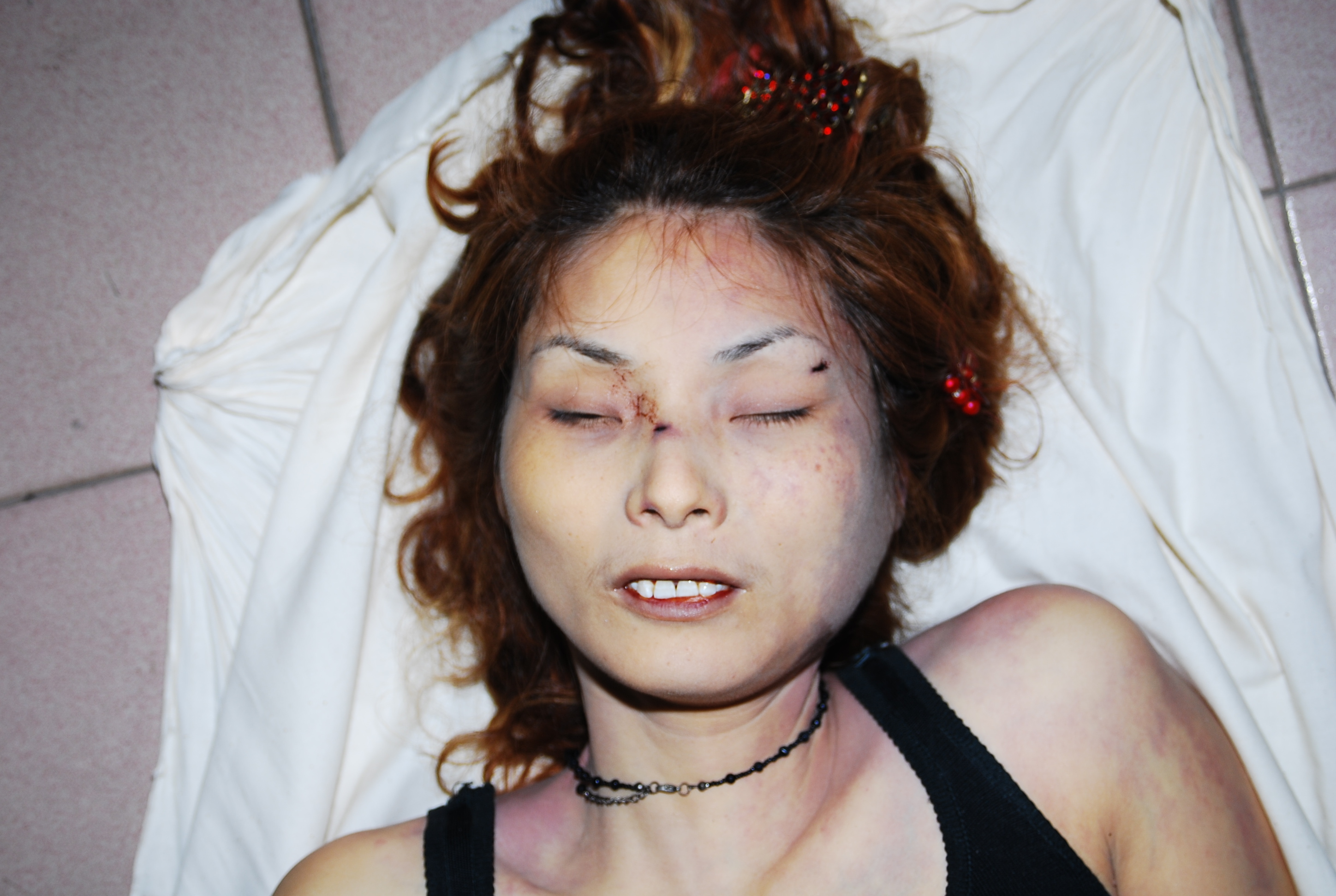 Chinese woman naked in morgue