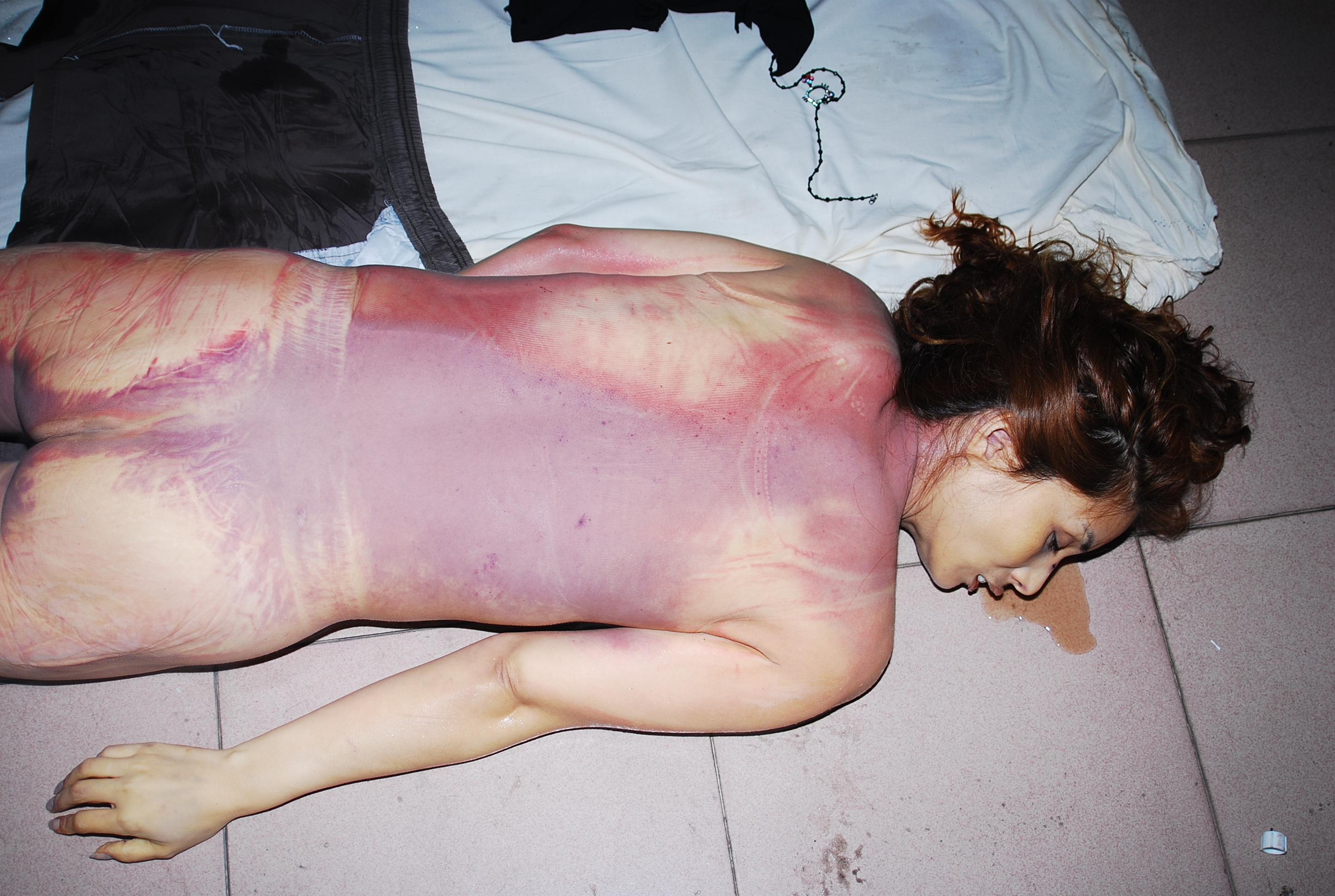 Chinese woman naked in morgue