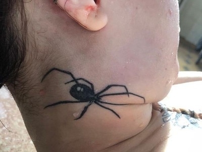 Ukranian tattooed dead woman laying on the autopsy table 