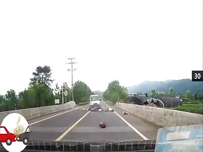 Crossing the motorbike road was hit by a truck