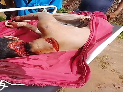 Body of young man killed with machete. 