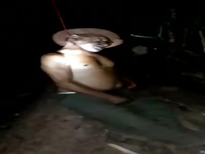 old man with cap commits suicide in the tree