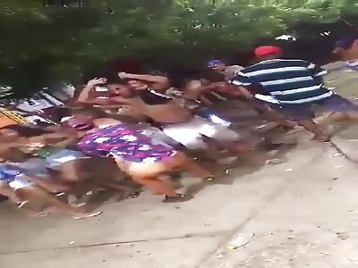people fight in street