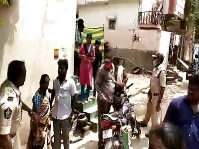 Indian police caning civilians. 