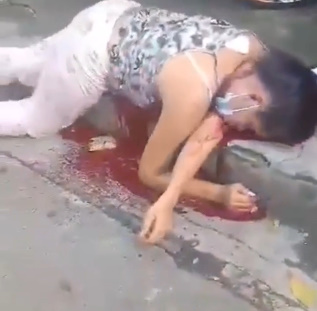 Masked Woman Shot Dead