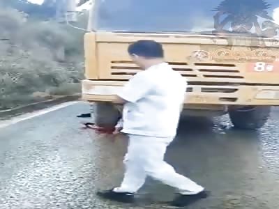 Stuck under a truck tire