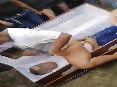 WOMAN DANCING AT FUNERAL