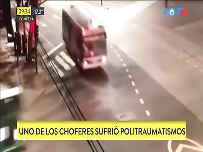 Bus passes red traffic light and ...