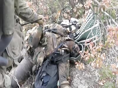 Russian soldier loots a corpse