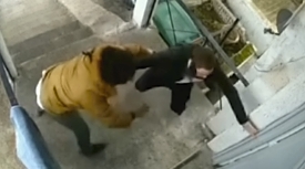 London: Robber violently rains punches down on his victim during phone robbery.