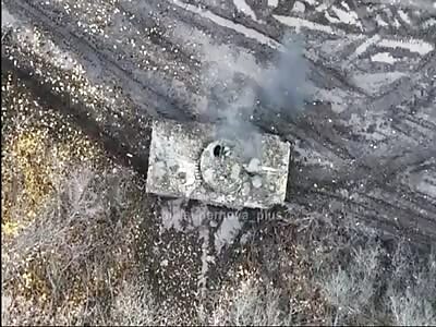 Ukrainian drone hits a Russian soldier on top of an armored vehicle