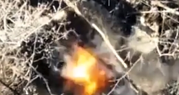 A mortar round explodes right next to two RU soldiers