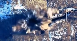 Two artillery hits on a Russian trench