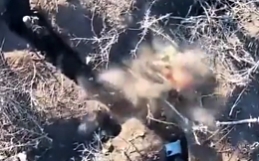 Grenade drop on a Russian dugout