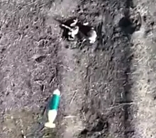 UA drone drops grenade on two RU soldiers