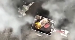 RU soldier looks up just as a grenade hits next to him