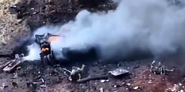 Torn apart T-72 with surviving russian troops visible