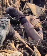 UA soldiers occupy a captured RU position with RU KIA