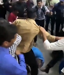 Blocking a train door in Mumbai