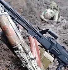 RU soldier filming a video in a ditch near the exit from Bakhmut