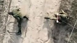 Ukrainian drone wounds two Russian soldiers carrying a jug