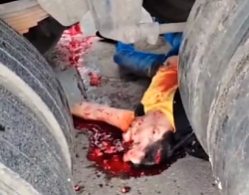 A motorcyclist was crushed by a truck