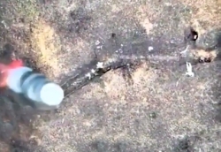 UA drone drops a grenade and hits two RU soldiers in a trench