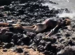 A man's corpse on a cliff