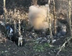 Ukrainian soldiers clearing a Russian trench