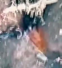 Grenade drops on top of a Russian soldier lying in a trench