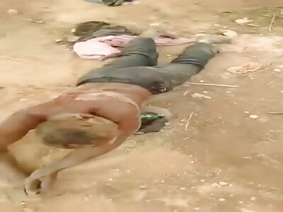 Thieves flogged on a muddy street