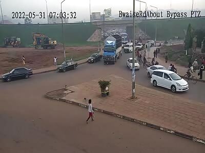 Death road, biker crushed by truck
