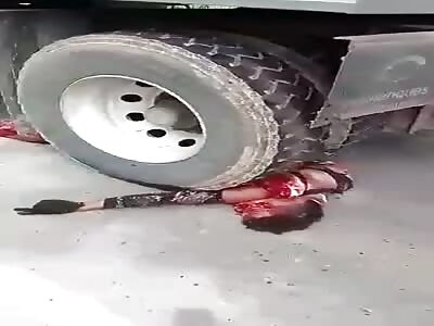 Biker dragged by truck wheels