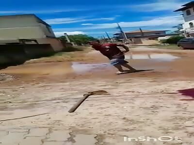 man is attacked with a mason's hoe