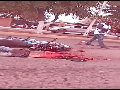 biker turned asphalt pizza