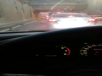 Mangled woman's body on the road after fatal collision.