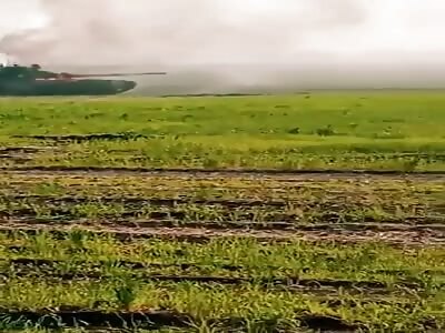 Ukrainian soldiers record video of burning Russian tanks.