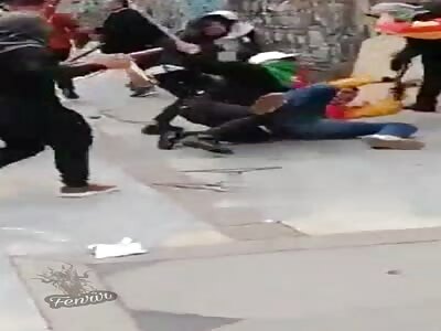 Policeman attacked during the protests in Bogotá.