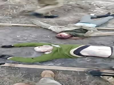  two bodies lying and one charred of the Russians