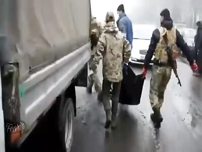 Ukrainian soldiers assigned to collect enemy corpses