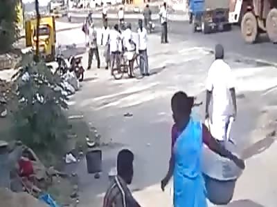 Truck Knocks Pedestrian Down and Crushes Another!