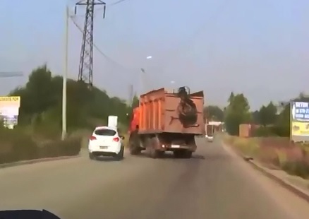 Dump Truck vs Little White Car..Hmm,