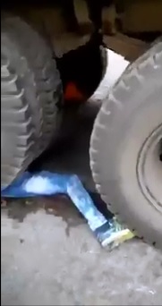 A Somber Aftermath..Man Pinned under the Wheels of Dump Truck 