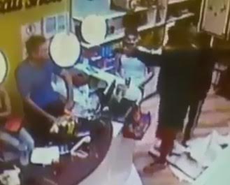 Store employee being executed with a shot in the face