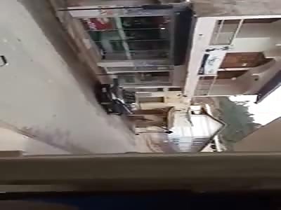 Villagers Walk Up a Murdered Police Man 